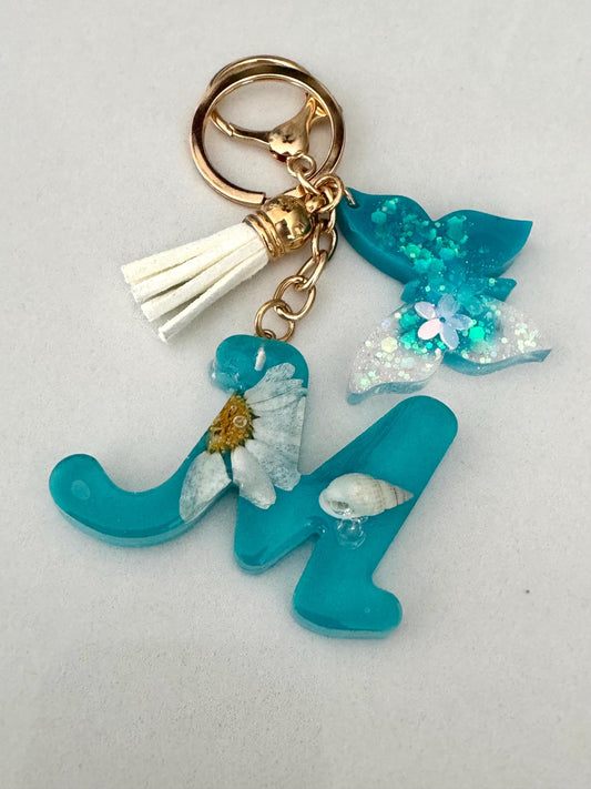 Personalized Resin Keychain with Butterfly Charm – Ocean Blue “M” with Real Flower & Seashell